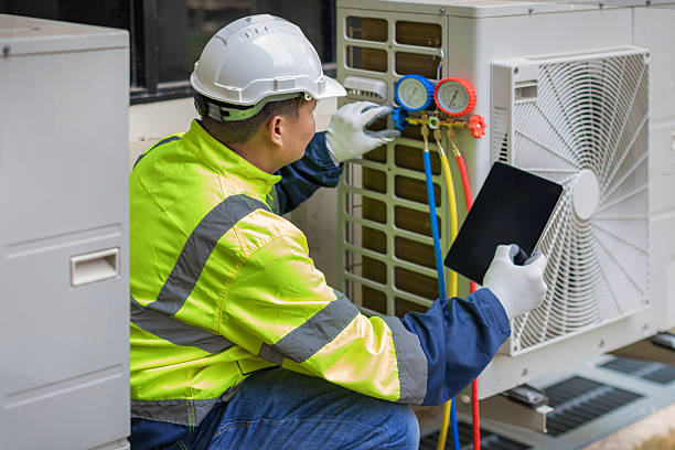 Professional Air Conditioning Repair technician working in Traver, CA
